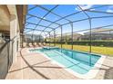 Private pool and spa with screened enclosure at 1455 Rolling Fairway Dr, Davenport, FL 33896