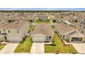 Community of new construction homes with green spaces at 1516 Quinta Rd, Kissimmee, FL 34744