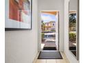 Bright and airy entryway with mirror and view of the exterior at 2713 Roadster Ln, Kissimmee, FL 34746