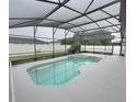 Relaxing screened-in pool with a spacious deck at 304 Ferrara Ct, Kissimmee, FL 34758