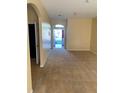 Bright entryway with view to the backyard through the open door at 4372 Paradise Cove Ct, Kissimmee, FL 34746