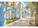 Light blue building exterior with sidewalk, landscaping, and a business sign at 651 Celebration Ave # 651, Celebration, FL 34747