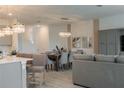 Open concept dining room with seating for eight at 800 Benoi Dr, Davenport, FL 33896