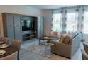 Spacious living area with built-in entertainment center at 800 Benoi Dr, Davenport, FL 33896
