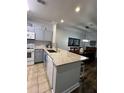 Modern kitchen with granite countertops and gray cabinets at 1375 Tuscana Ln # 1106, Davenport, FL 33896