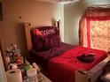 Bedroom with double bed and decorative wall hanging at 1370 Fern Ln, Daytona Beach, FL 32117