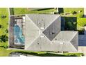 Home showing roofline and pool from above at 14962 Waterford Chase Pkwy, Orlando, FL 32828
