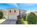 Two-story house with attached garage and landscaping at 14962 Waterford Chase Pkwy, Orlando, FL 32828