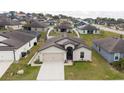 One-story house in a residential neighborhood at 1606 Steely Dr, Dundee, FL 33838