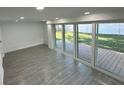 Bright finished basement with sliding glass doors leading to a deck at 2009 S Osceola Ave, Orlando, FL 32806