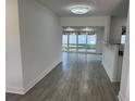 Open concept living space with gray tile floors and access to backyard at 2009 S Osceola Ave, Orlando, FL 32806