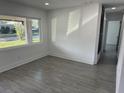 Spacious living room with large windows and gray tile floors at 2009 S Osceola Ave, Orlando, FL 32806