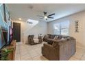 Spacious living room with sectional sofa and large TV at 2211 Bittle Way, St Cloud, FL 34769