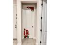 White interior door decorated with charming red rose decals at 2587 Summer Star Way, Leesburg, FL 34748