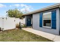 House with blue shutters, a white fence, and well-manicured landscaping at 540 E 19Th St, St Cloud, FL 34769