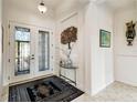 Bright entryway with double-door entry and decorative rug at 644 San Raphael St, Kissimmee, FL 34759