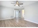 Spacious living room with wood-look floors at 645 King St, Eustis, FL 32726
