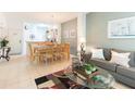 Living room with sofa, coffee table, and dining area at 8407 Crystal Cove Cv, Kissimmee, FL 34747