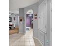 Bright entryway with view of dining area and kitchen at 8660 Buccilli Dr # 305, Orlando, FL 32829