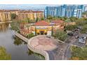 Aerial view of the resort with pool and lake at 12544 Floridays Resort Dr, Orlando, FL 32821