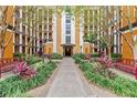 Courtyard entrance with landscaping and benches at 12544 Floridays Resort Dr, Orlando, FL 32821