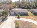Aerial view of a single Gathering home with a fenced pool and large backyard at 2219 Pilaklakaha Ave, Auburndale, FL 33823