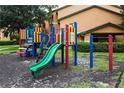 Community playground with colorful climbing structures and slides for enjoyment at 3004 Parkway Blvd # 208, Kissimmee, FL 34747