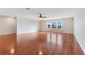 Large bonus room with hardwood floors and ceiling fan at 3074 White Horse Ct, Kissimmee, FL 34746