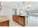 Spacious kitchen with island, stainless steel appliances, and granite countertops at 3074 White Horse Ct, Kissimmee, FL 34746