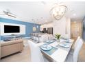 Open concept dining room and kitchen with modern fixtures at 4816 Memories Ln, Kissimmee, FL 34746