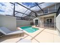 Private screened-in pool with lounge chair and patio area at 4816 Memories Ln, Kissimmee, FL 34746