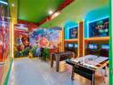 Game room with Mario theme, foosball, and air hockey at 6246 Sand Skipper Rd, Orlando, FL 32821