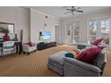Spacious living room with sectional sofa and access to balcony at 7509 Mourning Dove Cir # 304, Reunion, FL 34747