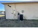 House exterior showing water softener and electric at 869 Colville Dr, Kissimmee, FL 34759