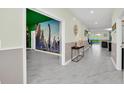 Bright entryway with dinosaur mural and tile flooring at 9194 Sommerset Hills Dr, Davenport, FL 33896