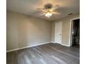 Bright bedroom with ceiling fan and gray flooring at 1051 S Hiawassee Rd # 2112, Orlando, FL 32835