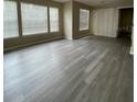 Spacious living room featuring gray vinyl plank flooring at 1051 S Hiawassee Rd # 2112, Orlando, FL 32835