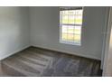 Bright bedroom with carpeted floors and large window at 1274 Fury St, Davenport, FL 33837