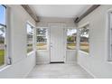 Bright sunroom with tiled floor and multiple windows at 1517 Missouri Ave, St Cloud, FL 34769