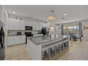 Modern kitchen with granite countertops and stainless steel appliances at 2612 Yountville Ave, Kissimmee, FL 34741