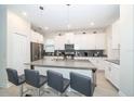 Spacious kitchen featuring modern white cabinets and a large island at 2746 Bookmark Dr, Kissimmee, FL 34746
