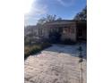 Tan manufactured home with steps leading to the front door at 34429 Laralack Ave, Leesburg, FL 34788