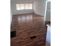 Spacious living room featuring wood-look flooring at 34429 Laralack Ave, Leesburg, FL 34788