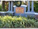 Sunset Lake Condominium entrance sign with festive holiday wreath at 4332 S Kirkman Rd # 1013, Orlando, FL 32811