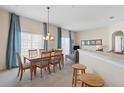 Dining room with table, chairs, and access to balcony at 7137 Harmony Square Dr # 31A, Harmony, FL 34773