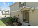 Green front door entrance with landscaping and walkway at 7137 Harmony Square Dr # 31A, Harmony, FL 34773