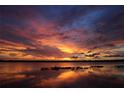Stunning sunset over a calm lake at 1186 Laguna Cir, St Cloud, FL 34771