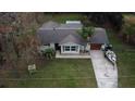 Aerial view showing house, yard, and driveway at 14636 Bray Rd, Orlando, FL 32832
