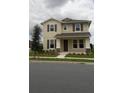 Two-story house with neutral siding, shutters, and landscaping at 15043 Pigeon Plum Ln, Winter Garden, FL 34787