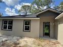 Inviting exterior of a newly constructed home with modern architecture and neutral color scheme at 2531 Buena Vista Dr, Deland, FL 32724